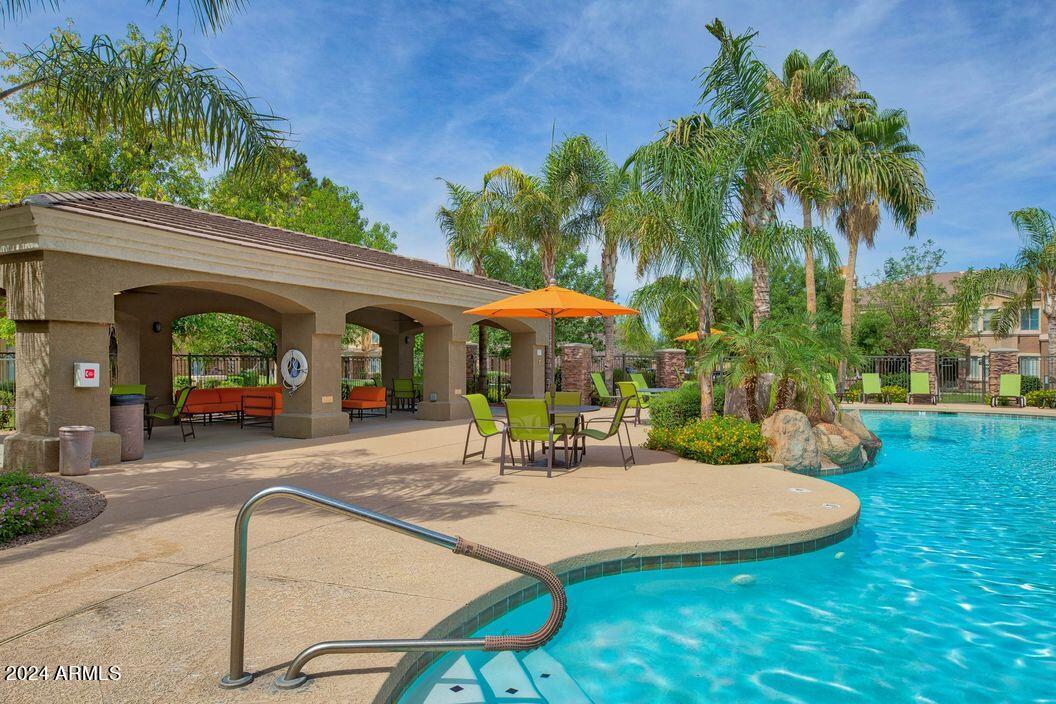 1367 South Country Club Drive, Unit 1153 Mesa, AZ 85210 - Photo 30 of 48 swimming pool view with a seating space