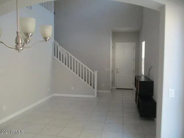 a kitchen with cabinets and stainless steel appliances