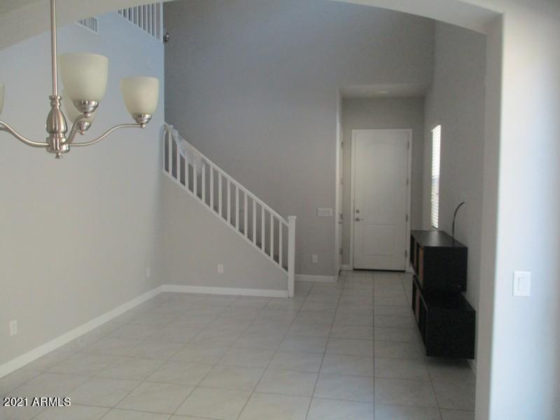 1367 South Country Club Drive, Unit 1153 Mesa, AZ 85210 - Photo 3 of 48 a view of a livingroom with a staircase