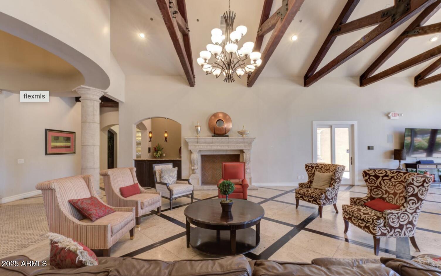 1367 South Country Club Drive, Unit 1153 Mesa, AZ 85210 - Photo 36 of 48 a living room with fireplace furniture and a chandelier