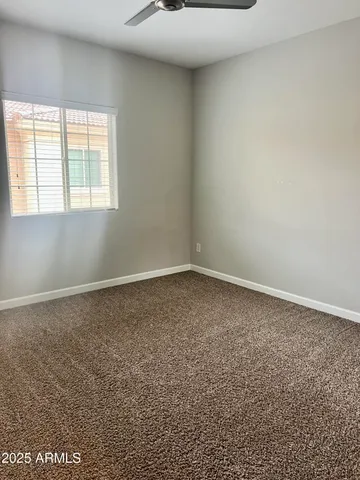 an empty room with a empty space and windows