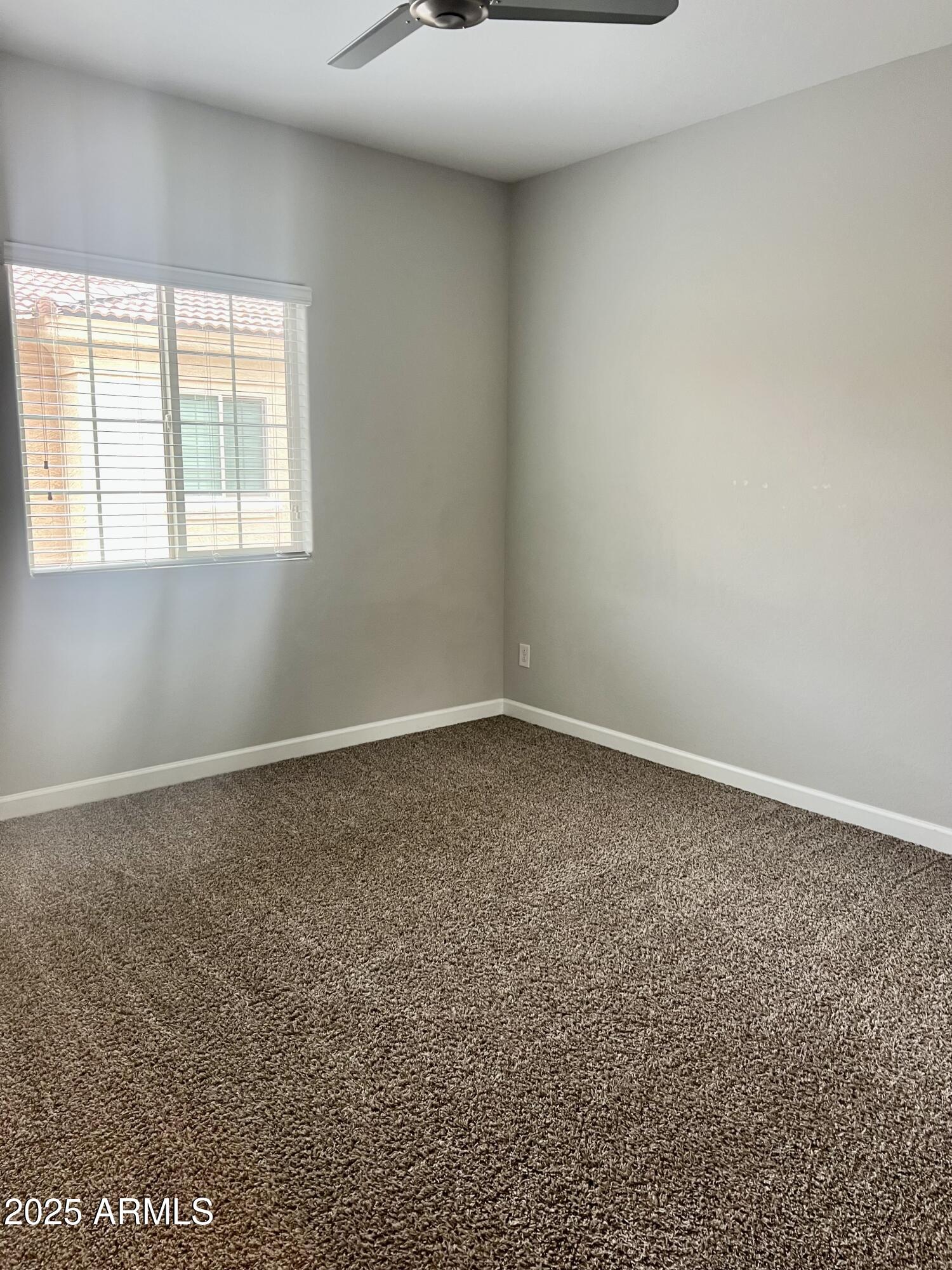 1367 South Country Club Drive, Unit 1153 Mesa, AZ 85210 - Photo 44 of 48 an empty room with a window