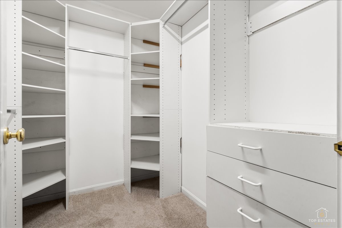 7 Eagle Court Streamwood, IL 60107 - Photo 21 of 31 a view of walk in closet with empty racks