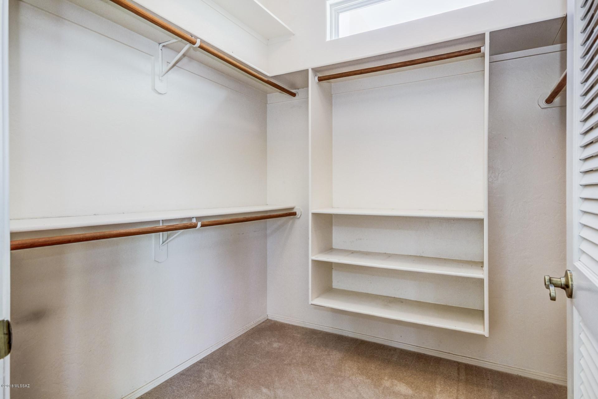 14480 North Swan Road Tucson, AZ 85739 - Photo 20 of 31 a view of an empty walk in closet