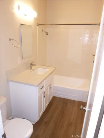 a bathroom with a sink a toilet and a bathtub