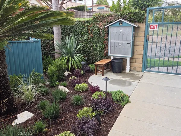 a view of a back yard of the house and a garden