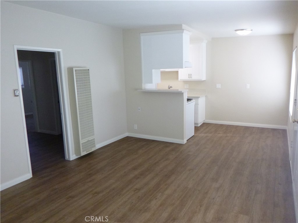 620 Prospect Avenue Long Beach, CA 90814 - Photo 6 of 11 an empty room with wooden floor and closet