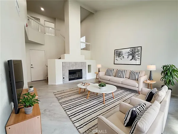 a bedroom with furniture and a fireplace