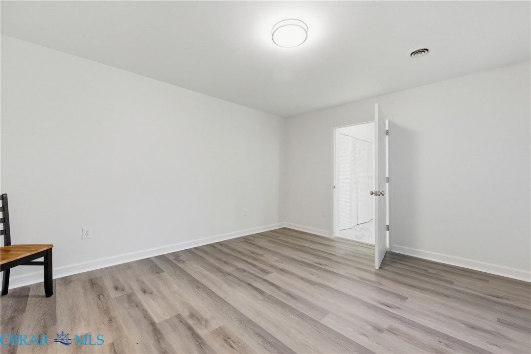 718 Dandy Loop Road Yorktown, VA 23692 - Photo 10 of 42 Spare room featuring light wood-type flooring and baseboards