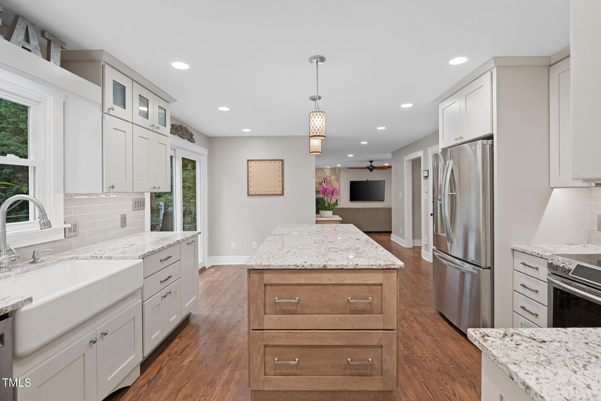 8608 Valley Brook Drive Raleigh, NC 27613 - Photo 15 of 74 a kitchen with a sink stainless steel appliances and cabinets