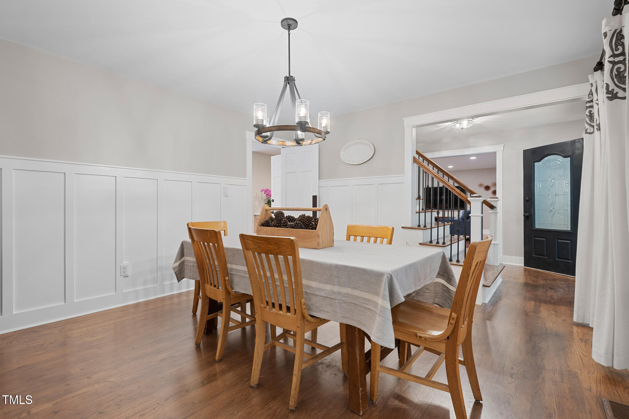 8608 Valley Brook Drive Raleigh, NC 27613 - Photo 20 of 74 a view of a dining room with furniture wooden floor and chandelier