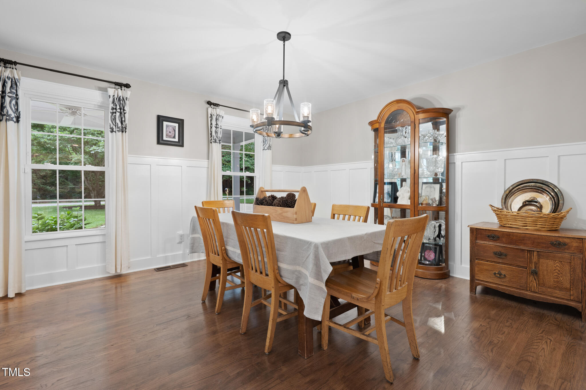 8608 Valley Brook Drive Raleigh, NC 27613 - Photo 21 of 74 a view of a dining room with furniture window and wooden floor