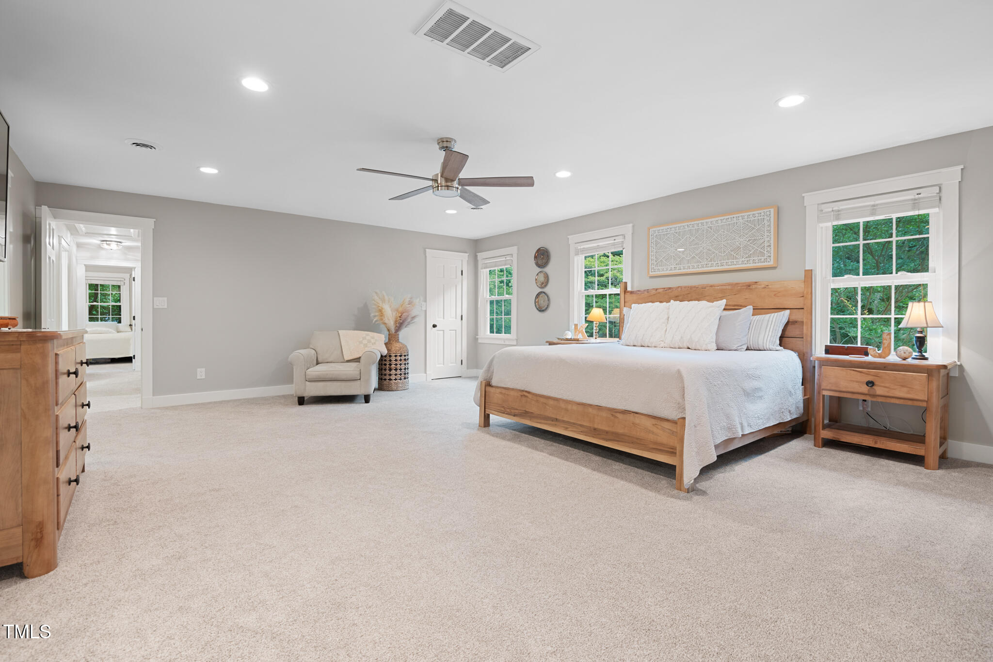 8608 Valley Brook Drive Raleigh, NC 27613 - Photo 26 of 74 a bedroom with a bed couch and window