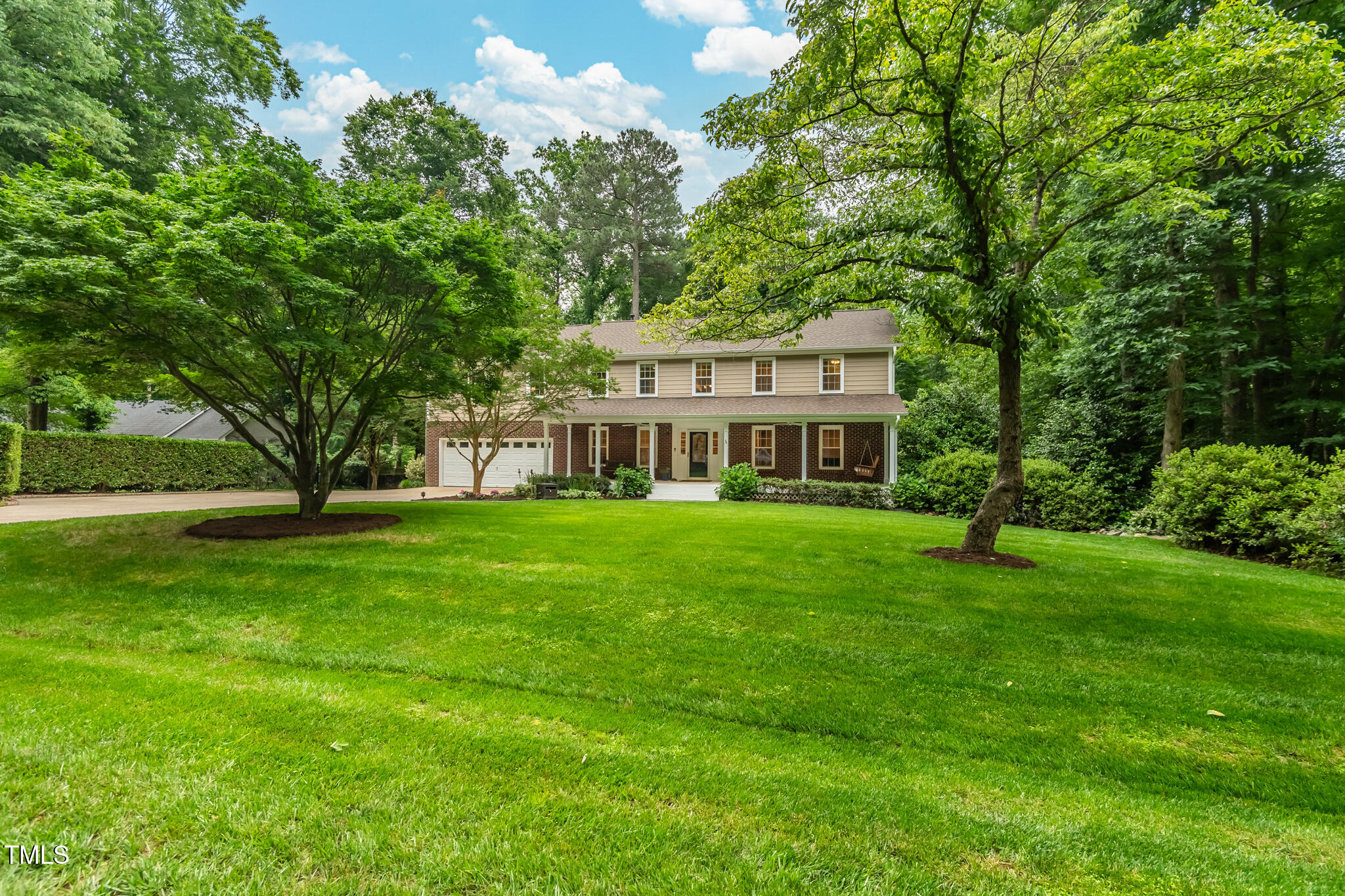 8608 Valley Brook Drive Raleigh, NC 27613 - Photo 2 of 74 a front view of a house with a yard