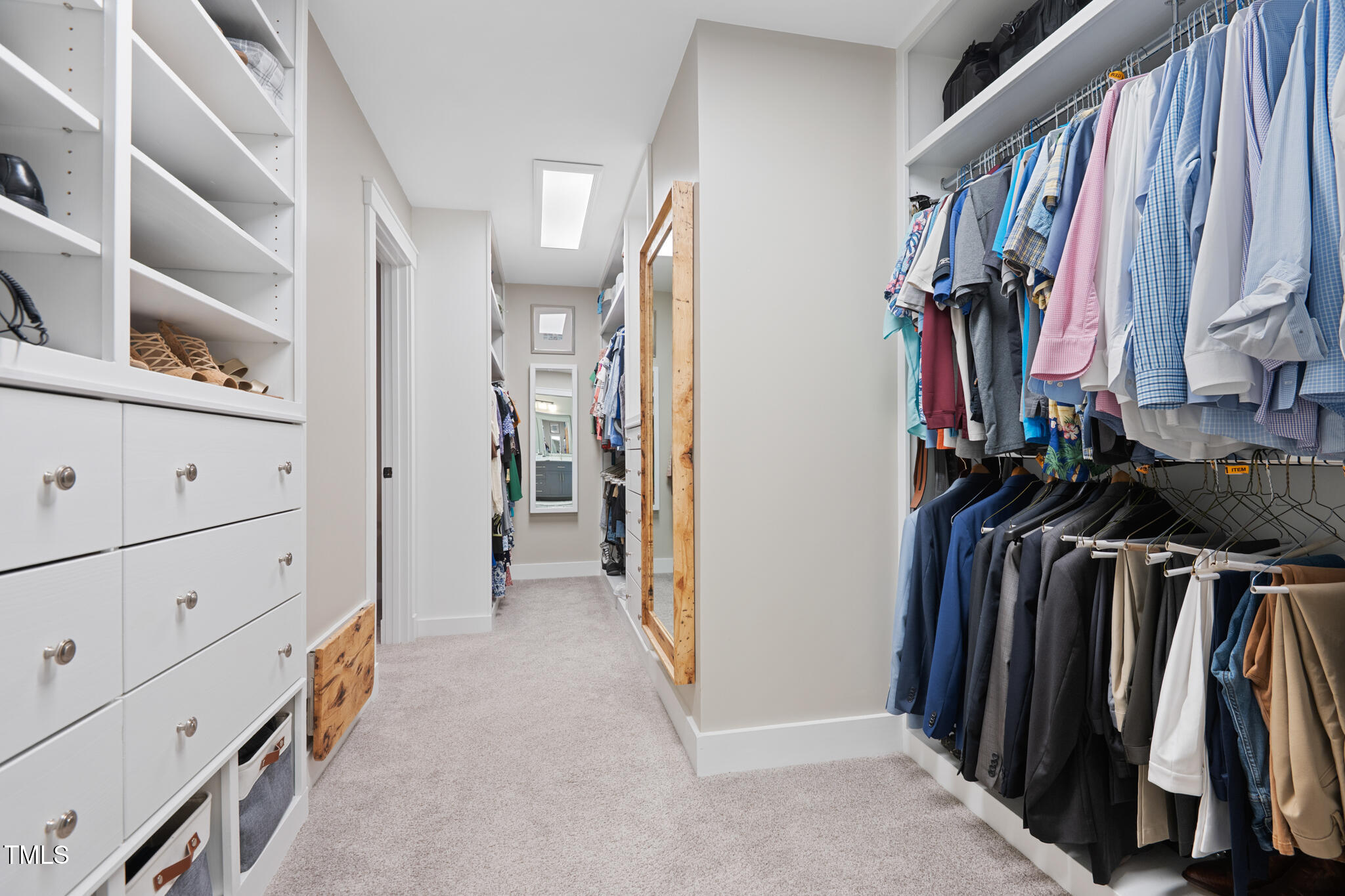 8608 Valley Brook Drive Raleigh, NC 27613 - Photo 28 of 74 a view of walk in closet with clothes and shoes