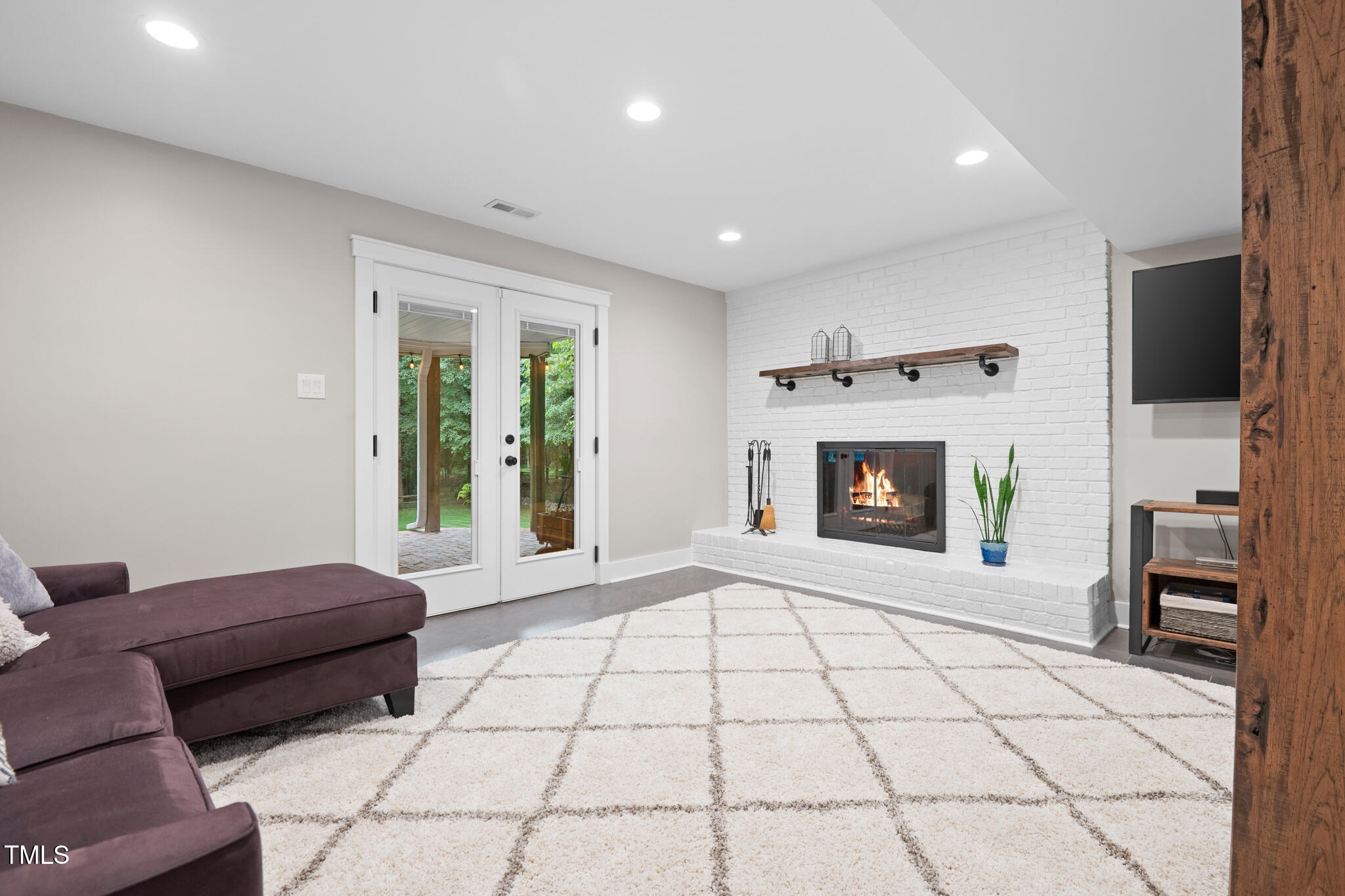 8608 Valley Brook Drive Raleigh, NC 27613 - Photo 47 of 74 a living room with furniture and a fireplace
