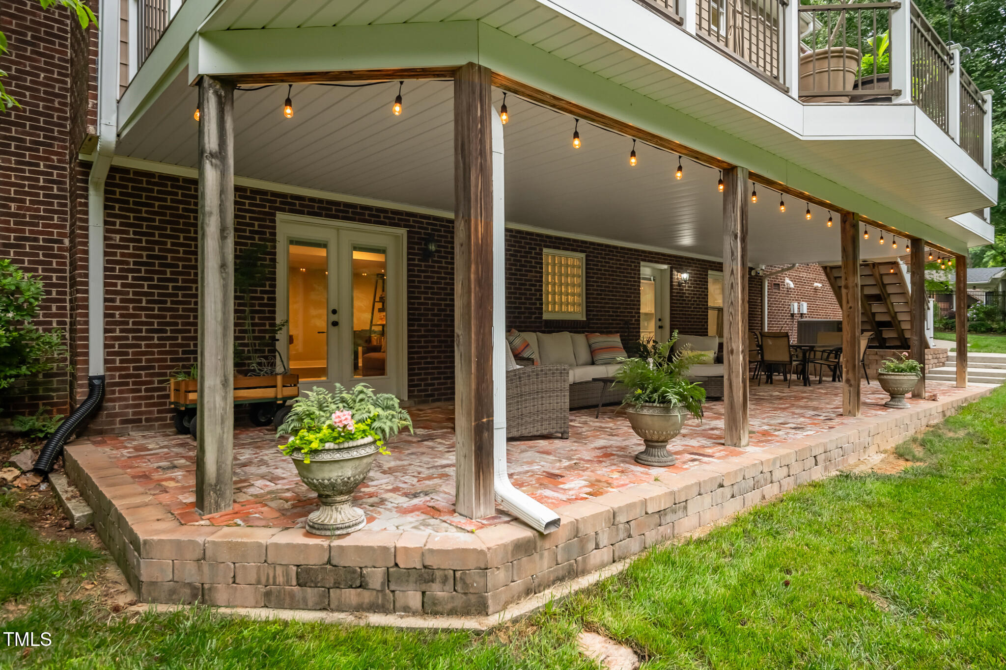 8608 Valley Brook Drive Raleigh, NC 27613 - Photo 57 of 74 a view of a house with a small yard plants and dining table