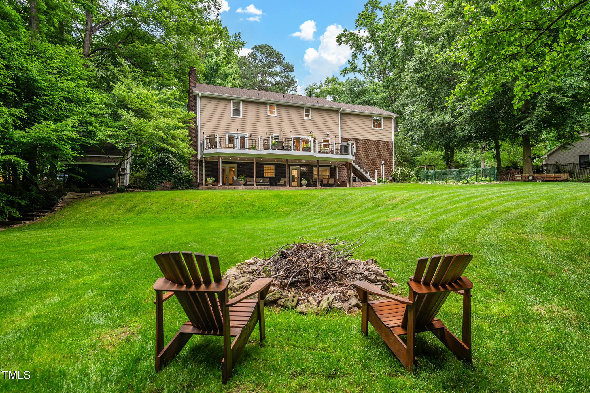 8608 Valley Brook Drive Raleigh, NC 27613 - Photo 64 of 74 a view of a house with backyard sitting area and garden