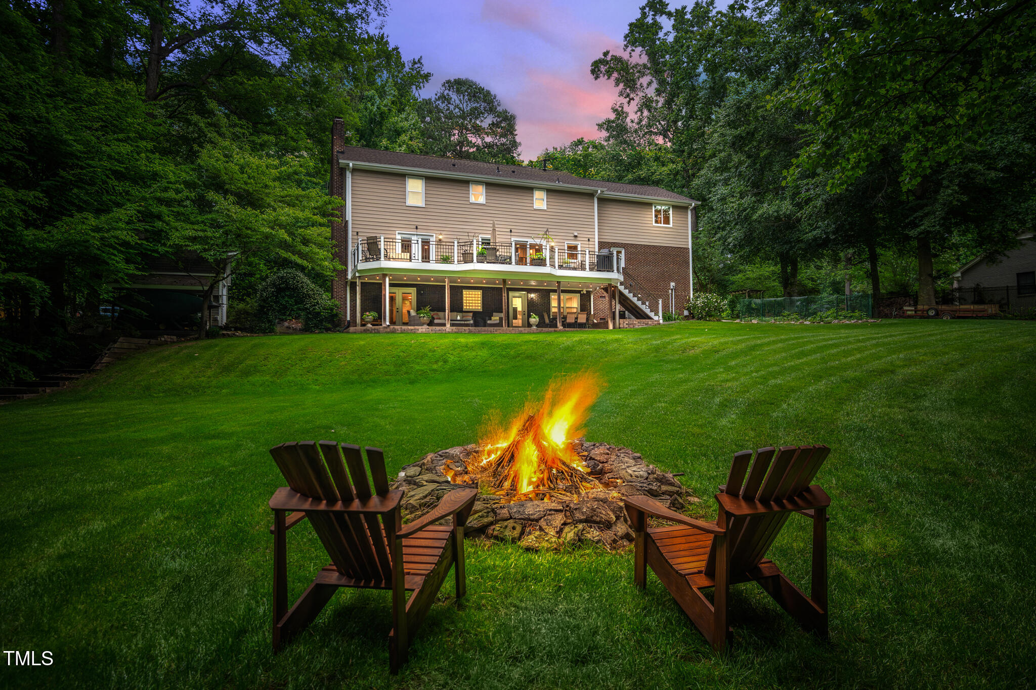 8608 Valley Brook Drive Raleigh, NC 27613 - Photo 65 of 74 a view of a house with backyard sitting area and garden