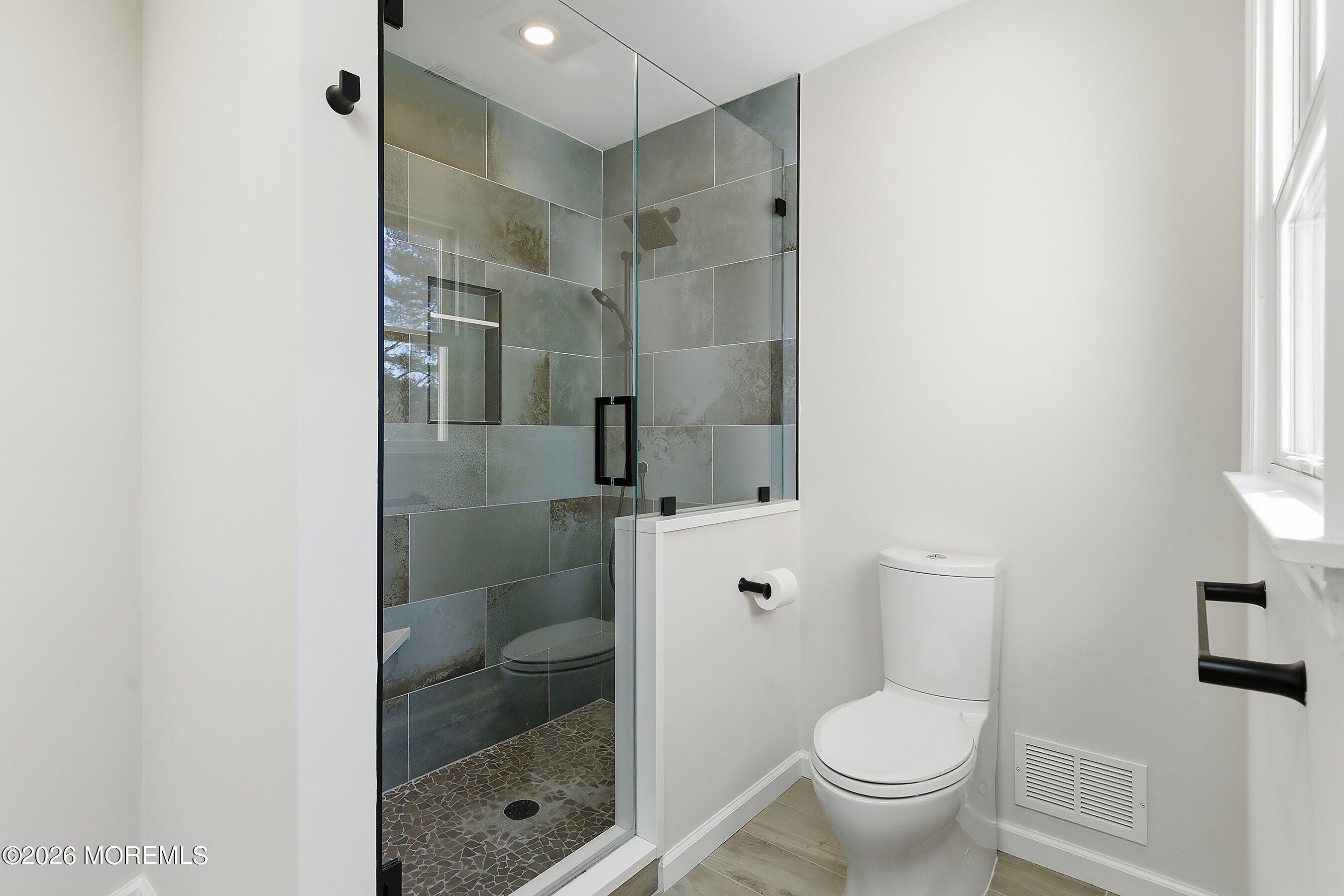 7 Shire Way Middletown, NJ 07748 - Photo 31 of 61 a bathroom with a shower and a toilet