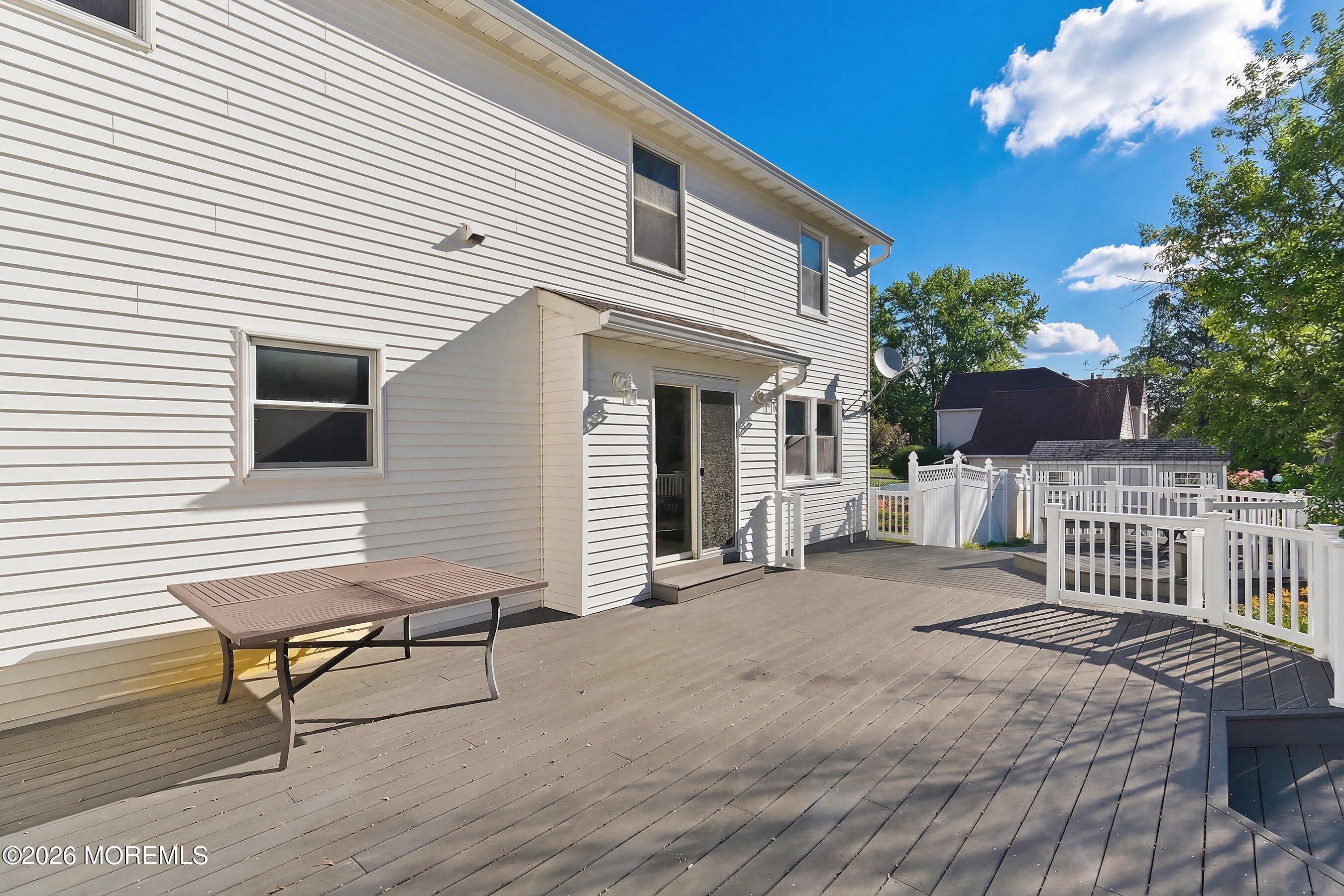 7 Shire Way Middletown, NJ 07748 - Photo 45 of 61 a view of a house with backyard and sitting area