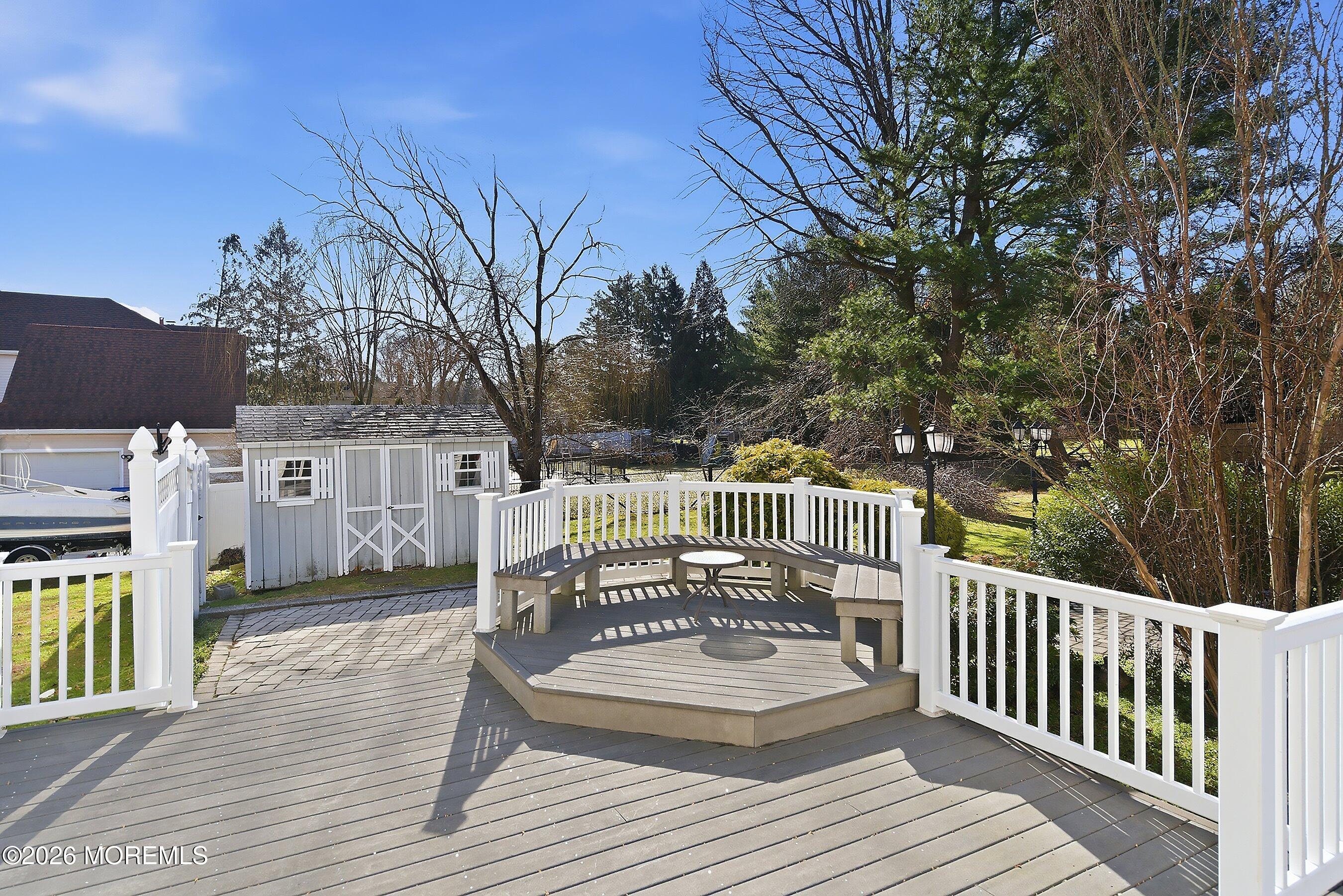 7 Shire Way Middletown, NJ 07748 - Photo 47 of 61 a view of a wooden deck with chairs