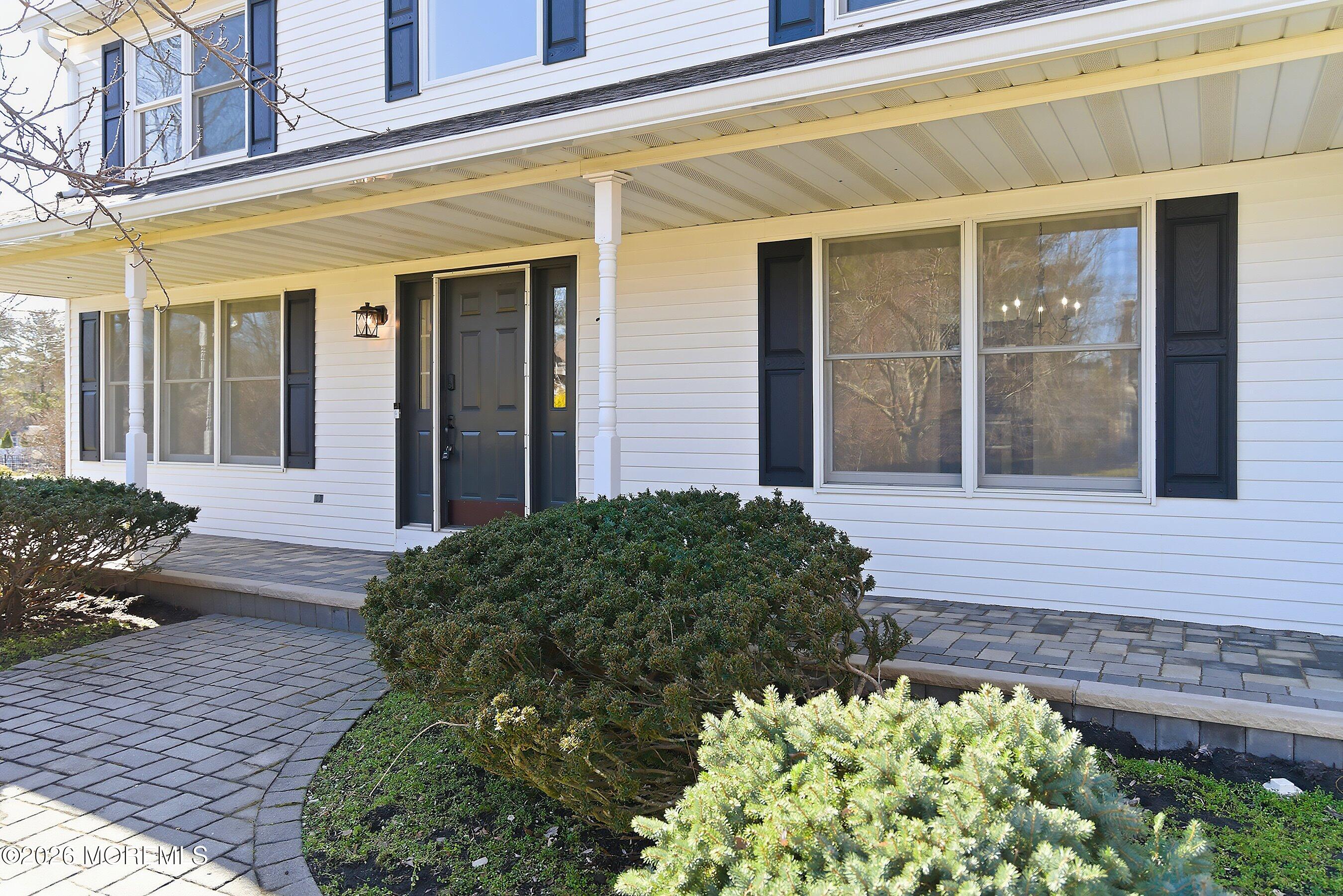 7 Shire Way Middletown, NJ 07748 - Photo 5 of 61 front view of a brick house with a large window