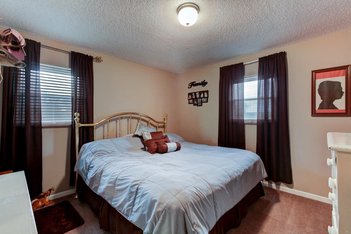 10704 Mountain Road Luttrell, TN 37779 - Photo 15 of 25 a bedroom with a bed and painting on the wall