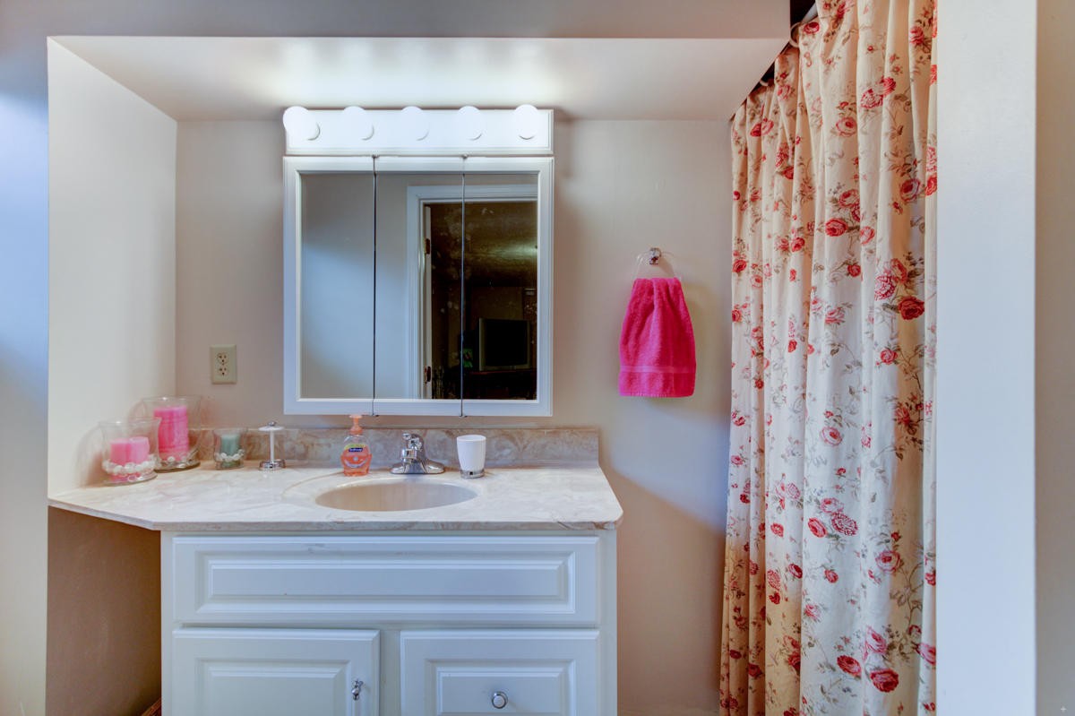 10704 Mountain Road Luttrell, TN 37779 - Photo 18 of 25 a bathroom with a sink and a mirror