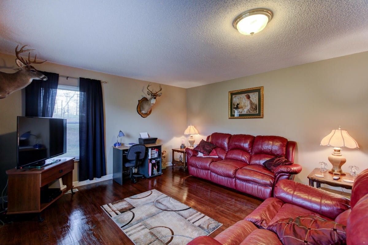 10704 Mountain Road Luttrell, TN 37779 - Photo 6 of 25 a living room with furniture and a flat screen tv