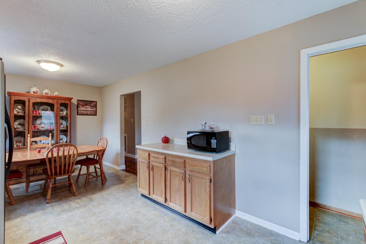 10704 Mountain Road Luttrell, TN 37779 - Photo 9 of 25 a living room with furniture a piano and a flat screen tv
