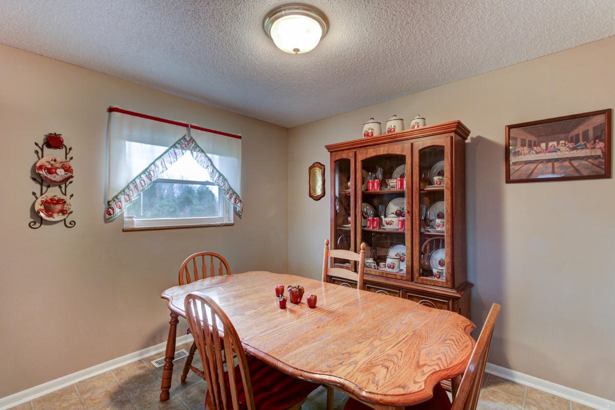 10704 Mountain Road Luttrell, TN 37779 - Photo 10 of 25 a dining room with furniture and window