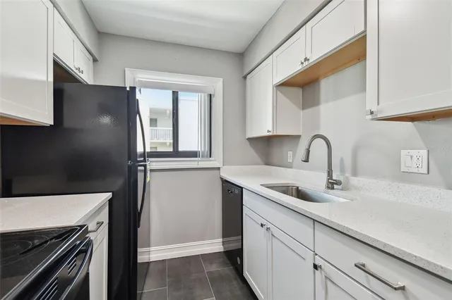 a kitchen with a stove and a sink