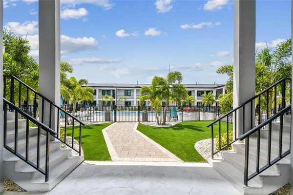 a view of houses with yard and outdoor seating