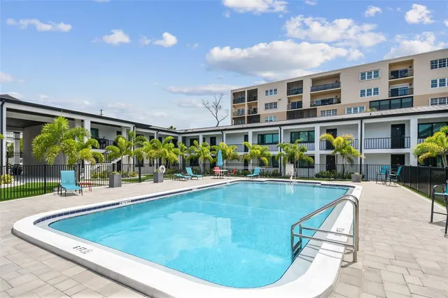 a view of a swimming pool with a patio