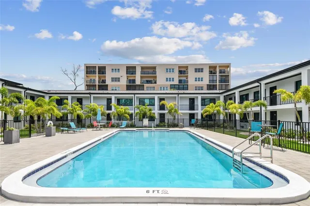 a view of sign board with potted plants