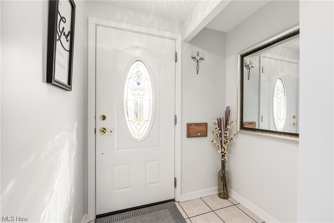 7094 Brandywine Road Parma Heights, OH 44130 - Photo 16 of 49 Foyer entrance featuring a healthy amount of sunlight and light tile floors