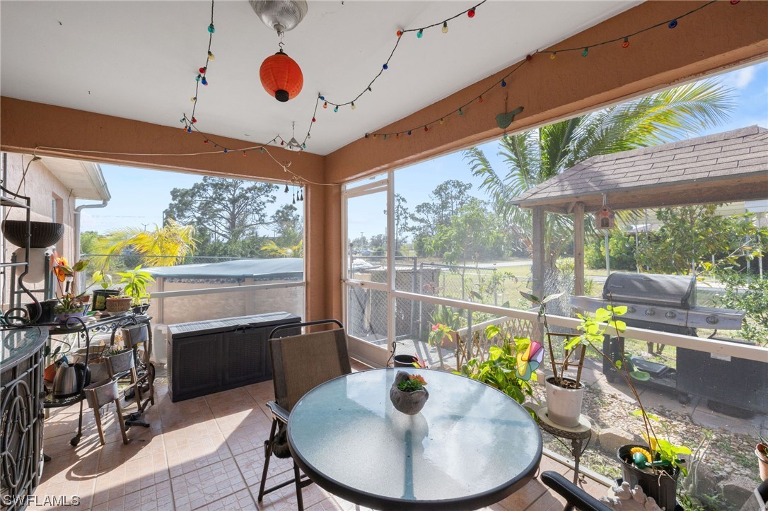 811 Abrams Boulevard Lehigh Acres, FL 33971 - Photo 16 of 22 a dining room with furniture mountain view and a garden