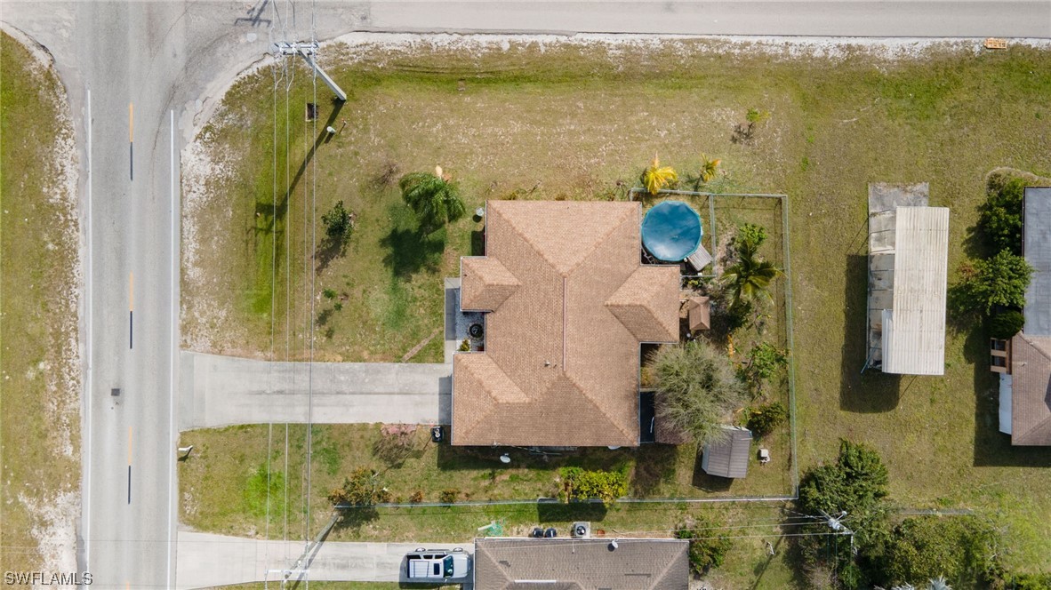 811 Abrams Boulevard Lehigh Acres, FL 33971 - Photo 19 of 22 an aerial view of a residential houses with outdoor space