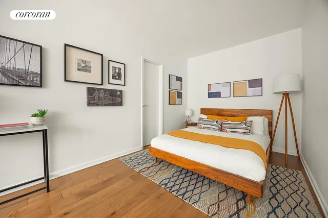 a kitchen with white cabinets and window