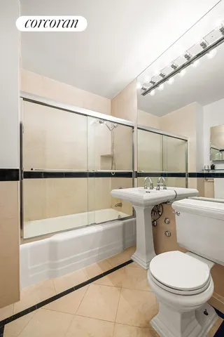 a living room with furniture or couch and a potted plant