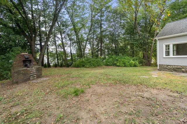 a view of a yard with of trees