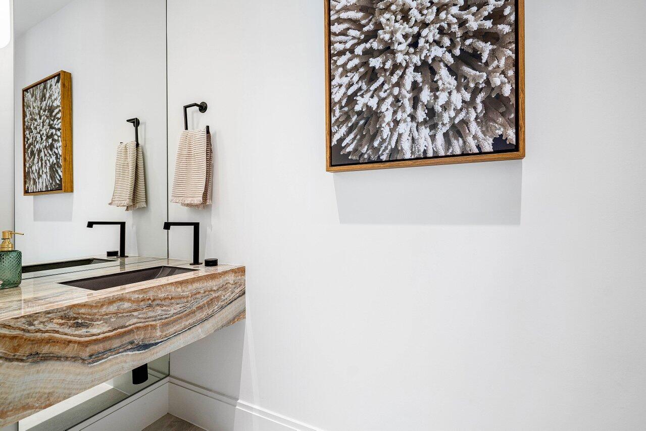 514 Northeast 7th Avenue Delray Beach, FL 33483 - Photo 13 of 51 a bathroom with a granite countertop sink and a mirror