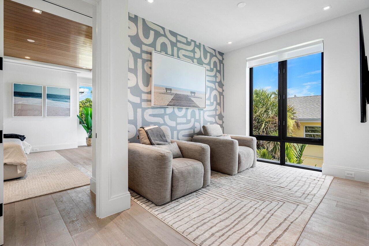 514 Northeast 7th Avenue Delray Beach, FL 33483 - Photo 18 of 51 a living room with furniture and a floor to ceiling window