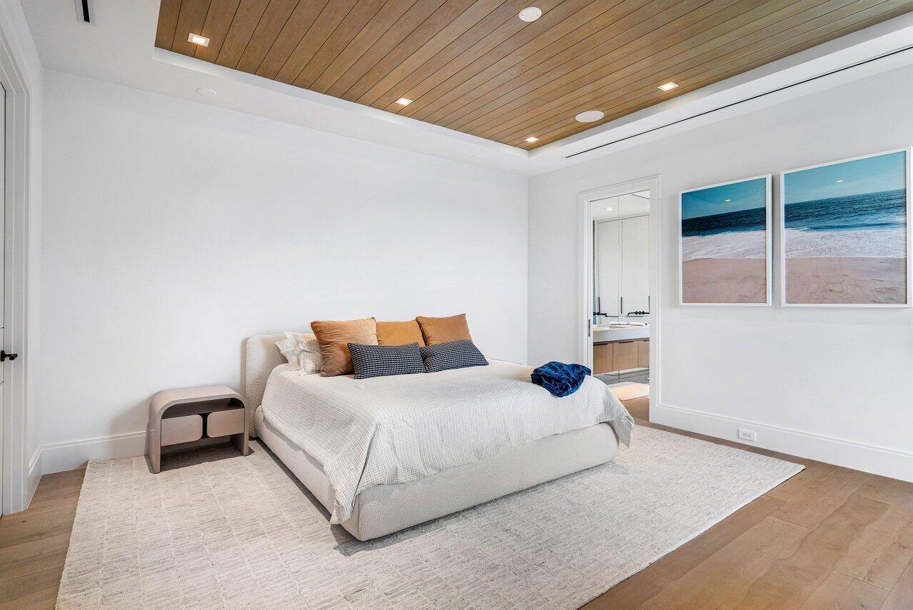 514 Northeast 7th Avenue Delray Beach, FL 33483 - Photo 20 of 51 a bedroom with bed and a large window