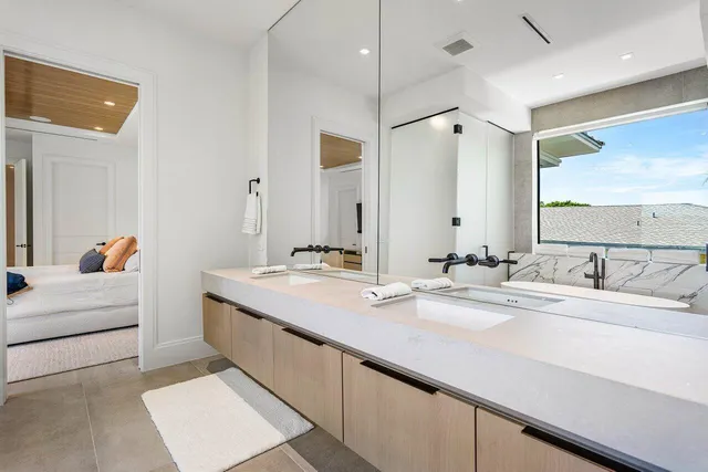 a bathroom with a double vanity sink mirror and double