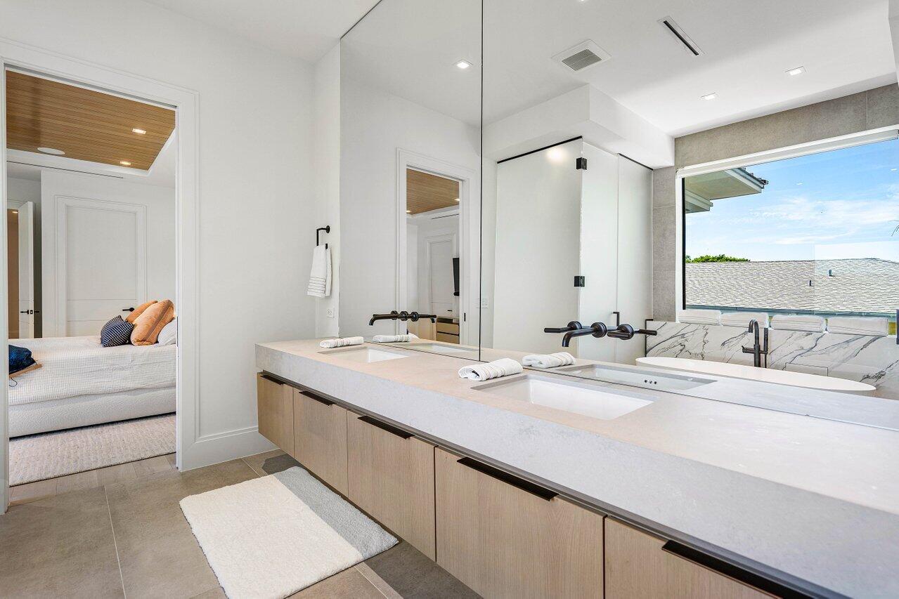 514 Northeast 7th Avenue Delray Beach, FL 33483 - Photo 25 of 51 a bathroom with a double vanity sink mirror and double