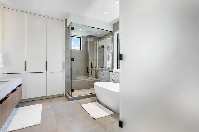 a spacious bathroom with a shower and a toilet