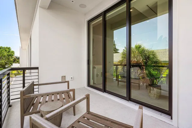 a view of a balcony with chairs