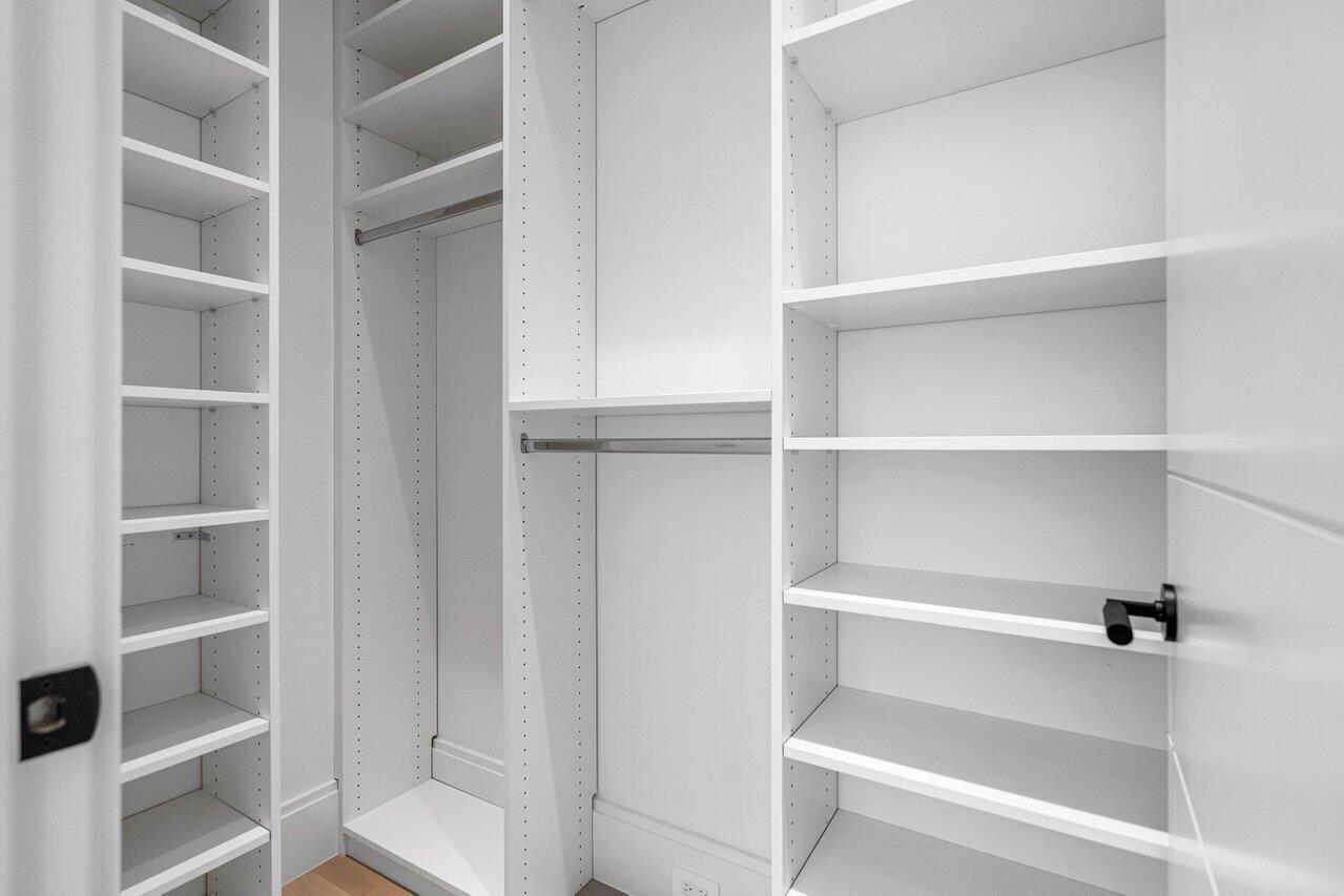514 Northeast 7th Avenue Delray Beach, FL 33483 - Photo 34 of 51 a view of walk in closet with empty racks